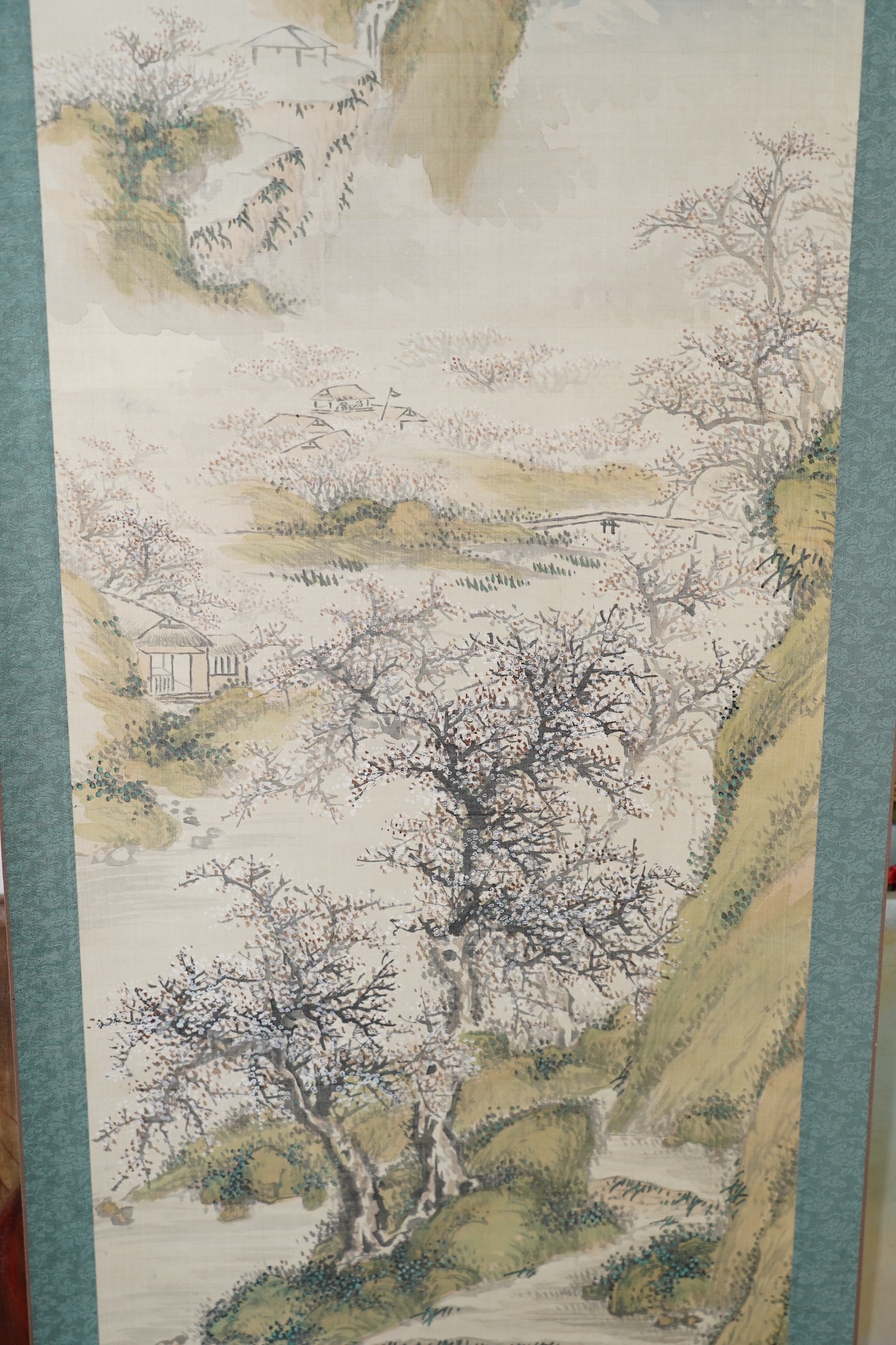Five Japanese scroll paintings, 19th and 20th century, including two landscapes, birds, a flower study and a calligraphic inscription. Condition - ranging from poor to good